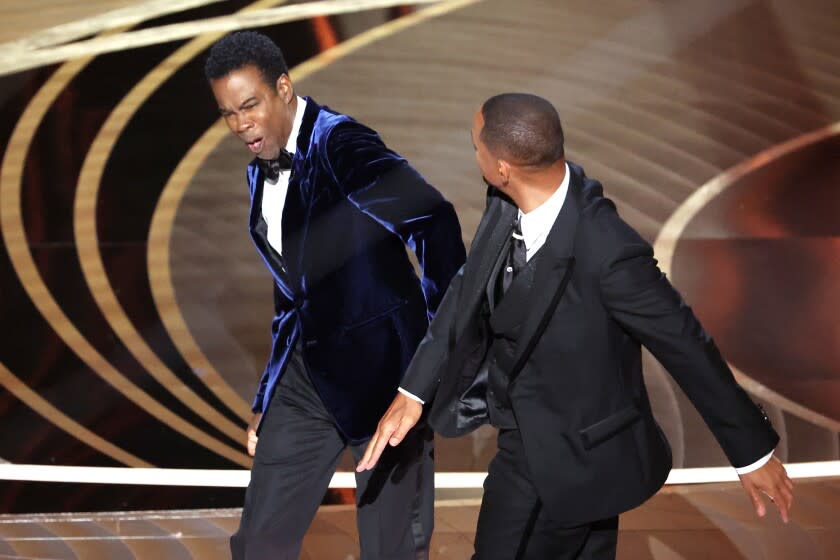 HOLLYWOOD, CA - March 27, 2022. Will Smith slaps Chris Rock onstage during the show at the 94th Academy Awards at the Dolby Theatre at Ovation Hollywood on Sunday, March 27, 2022. (Myung Chun / Los Angeles Times)