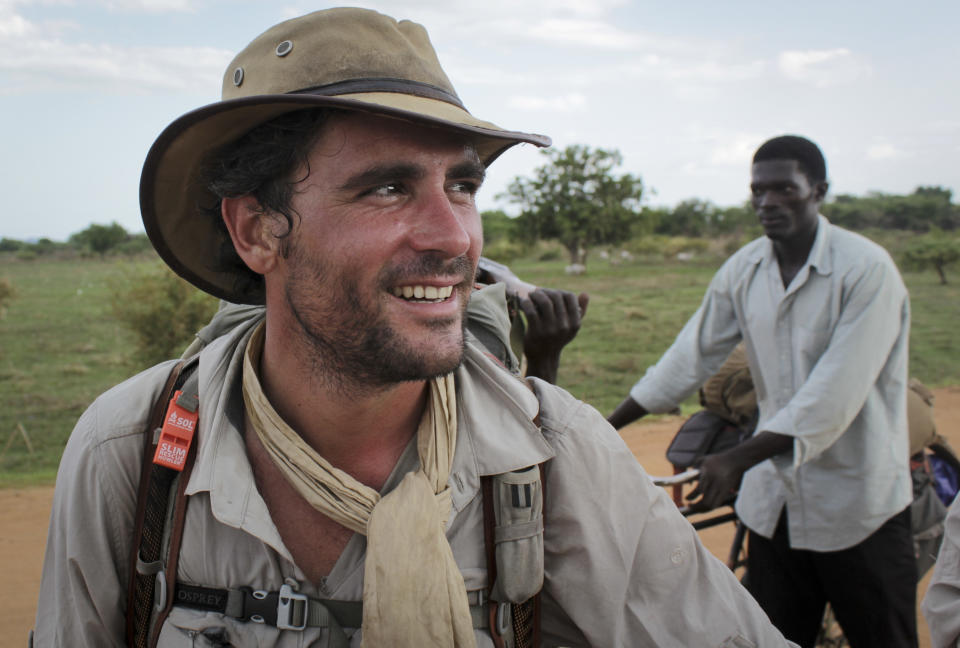 In this photo taken Wednesday, April 9, 2014, former British Army captain Levison Wood sets out walking along the Nile river from Juba, in South Sudan. Close calls with crocodiles and a brutal civil war have not deterred Levison from attempting to walk the length of the Nile, a 4,250 mile journey along the world's longest river that will see him pass through seven countries. (AP Photo/Ilya Gridneff)