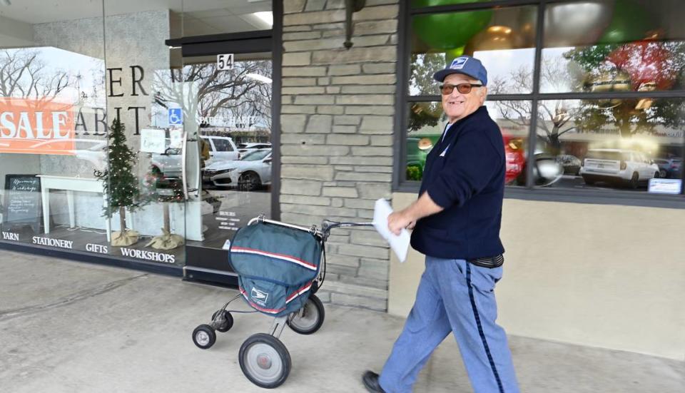 Dave Costa delivers the mail at McHenry Village in Modesto, Calif., Wednesday, Dec. 27, 2023. Costa, who started delivering the mail on a bicycle in 1967, is retiring Wednesday after more than 56 years with the Postal Service.