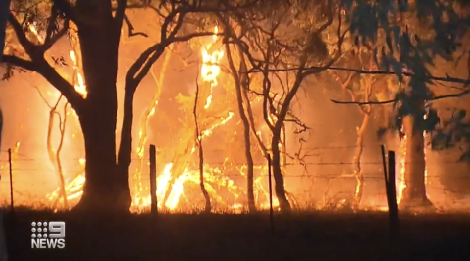 A fire threatens a home in WA.