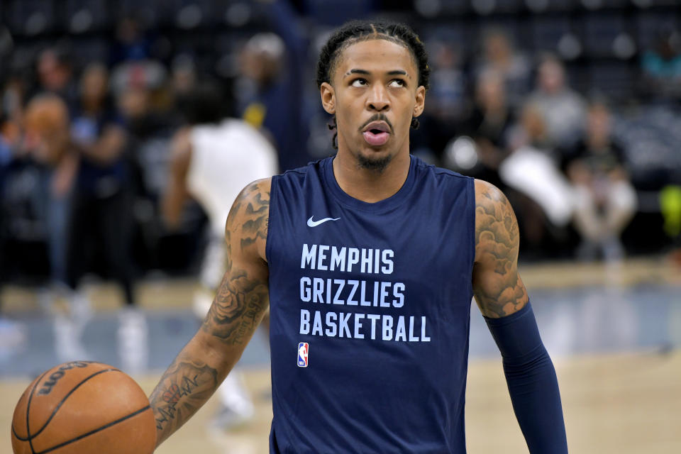 Memphis Grizzlies guard Ja Morant warms up before an NBA basketball game against the Indiana Pacers, Thursday, Dec. 21, 2023, in Memphis, Tenn. (AP Photo/Brandon Dill)