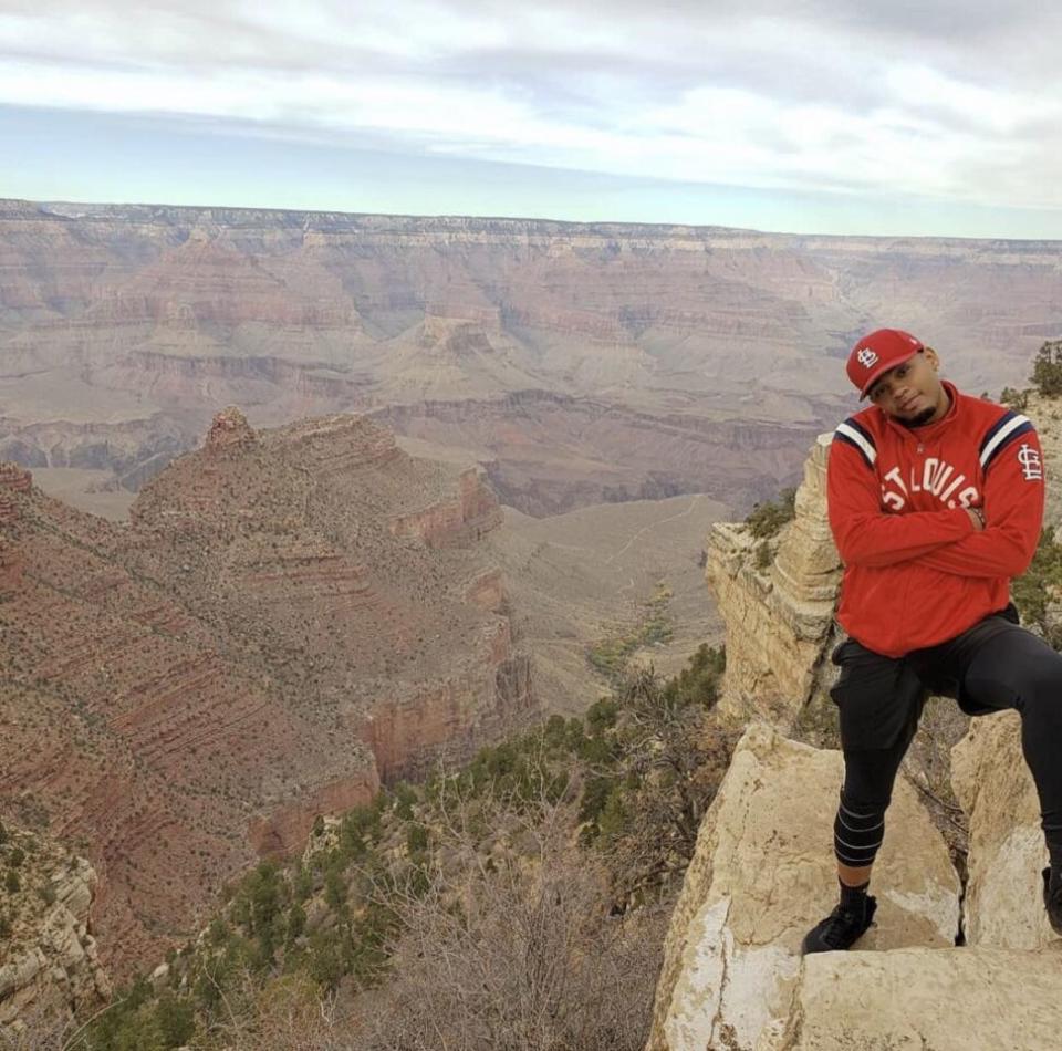 man standing near canyon