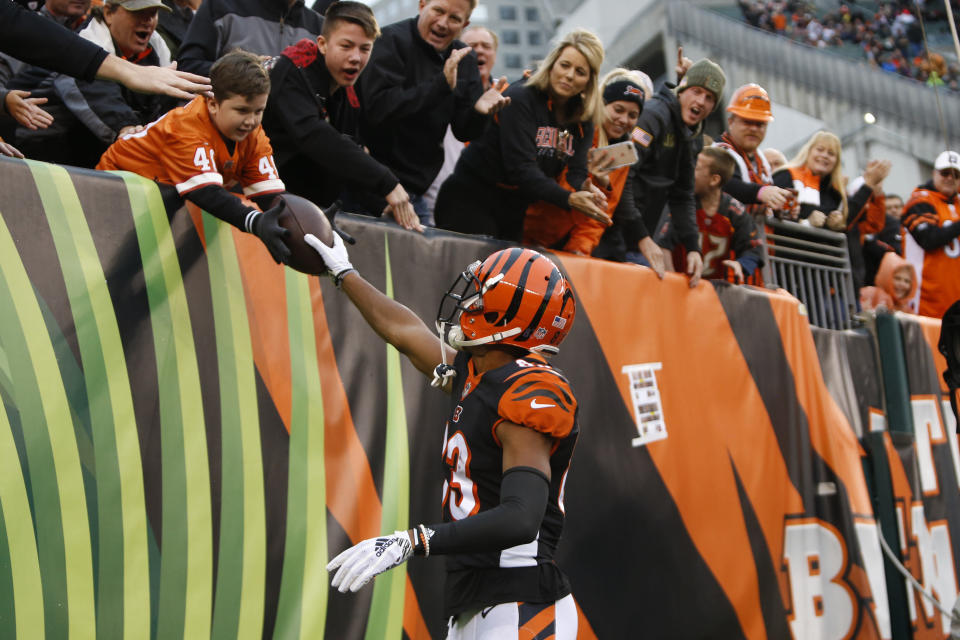 Cincinnati Bengals wide receiver Tyler Boyd (83) gives a ball to a fan after a touchdown catch against the Tampa Bay Buccaneers during the first half of an NFL football game in Cincinnati, Sunday, Oct. 28, 2018. (AP Photo/Frank Victores)