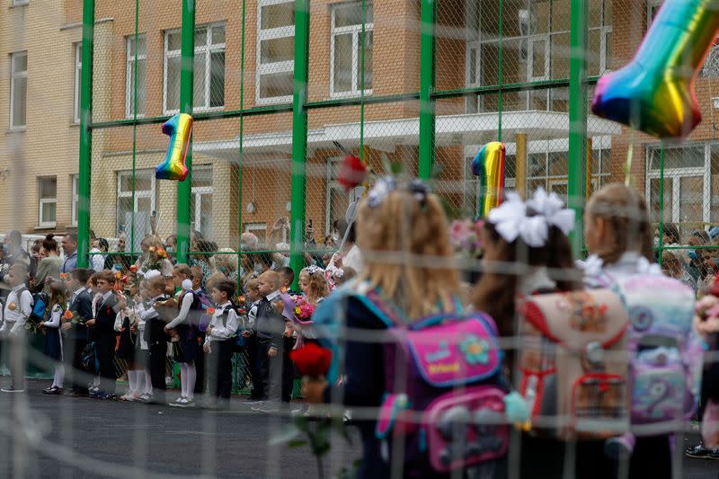 FILE PHOTO: First graders attend a ceremony marking the start of the new school year in Moscow