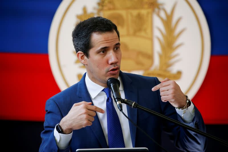 Venezuela's opposition leader Juan Guaido addresses the media the day after regional and local elections, in Caracas