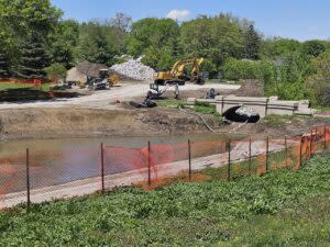  The Pershing Mural is to be reinstalled on a wall near where the construction machines and big rock pile are. (Courtesy of Pershing Mural Preservation Committee)