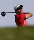 Spain's Rafa Cabrera-Bello plays a shot during the first round of the Abu Dhabi Golf Championship in the Emirati capital on January 17, 2013. Justin Rose grabbed a share of the first round lead in the Abu Dhabi Golf Championship on a day when both Rory McIlroy and Tiger Woods struggled to get their seasons into gear