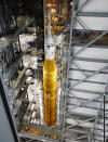 NASA's Artemis rocket, with the Orion spacecraft aboard, stands in the vehicle assembly building before rolling out to launch pad 39B at the Kennedy Space Center, Tuesday, Aug. 16, 2022, in Cape Canaveral, Fla. NASA is aiming for an Aug. 29 liftoff for the lunar test flight. No one will be inside the crew capsule atop the rocket, just three mannequins. (AP Photo/Terry Renna)