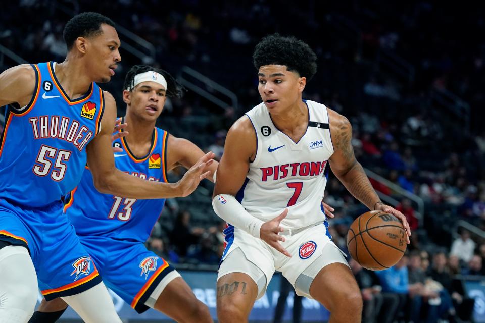 Pistons guard Killian Hayes is defended by Thunder forward Darius Bazley, left, and forward Ousmane Dieng during the first half of the preseason game on Tuesday, Oct. 11, 2022, at Little Caesars Arena.