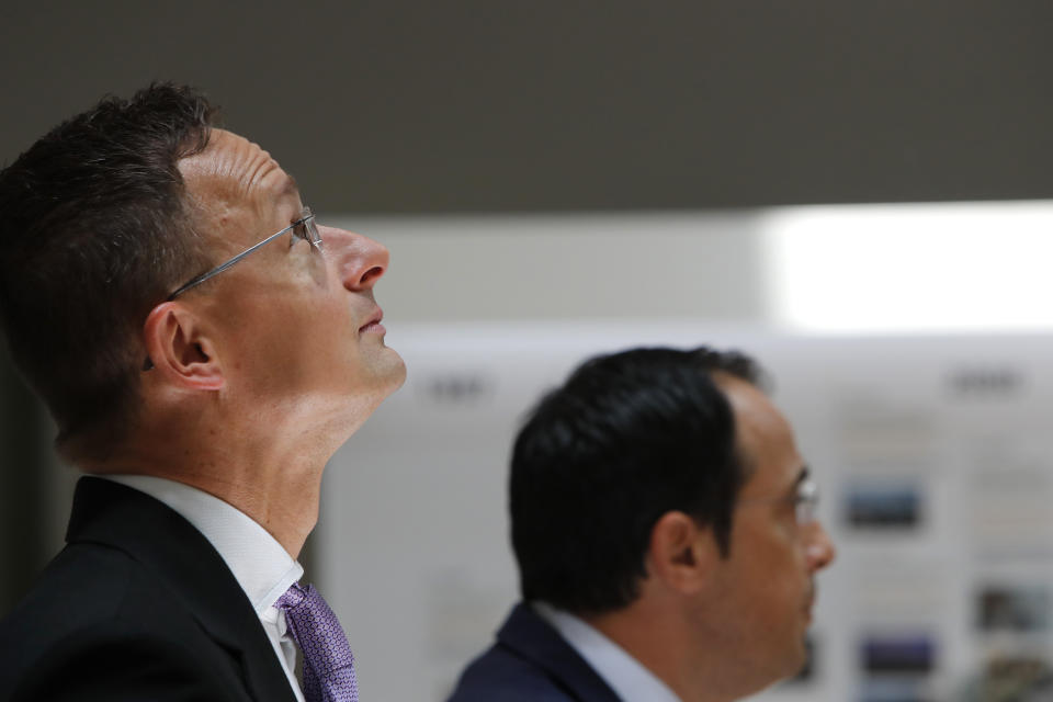 Hungarian Minister of Foreign Affairs and Trade Peter Szijjarto, left, and Cyprus' Foreign Minister Nikos Christodoulides speak during a news conference at the Cypriot foreign ministry on Friday, June 26, 2020. Szijjarto is in Cyprus for one-day visit. (AP Photo/Petros Karadjias)