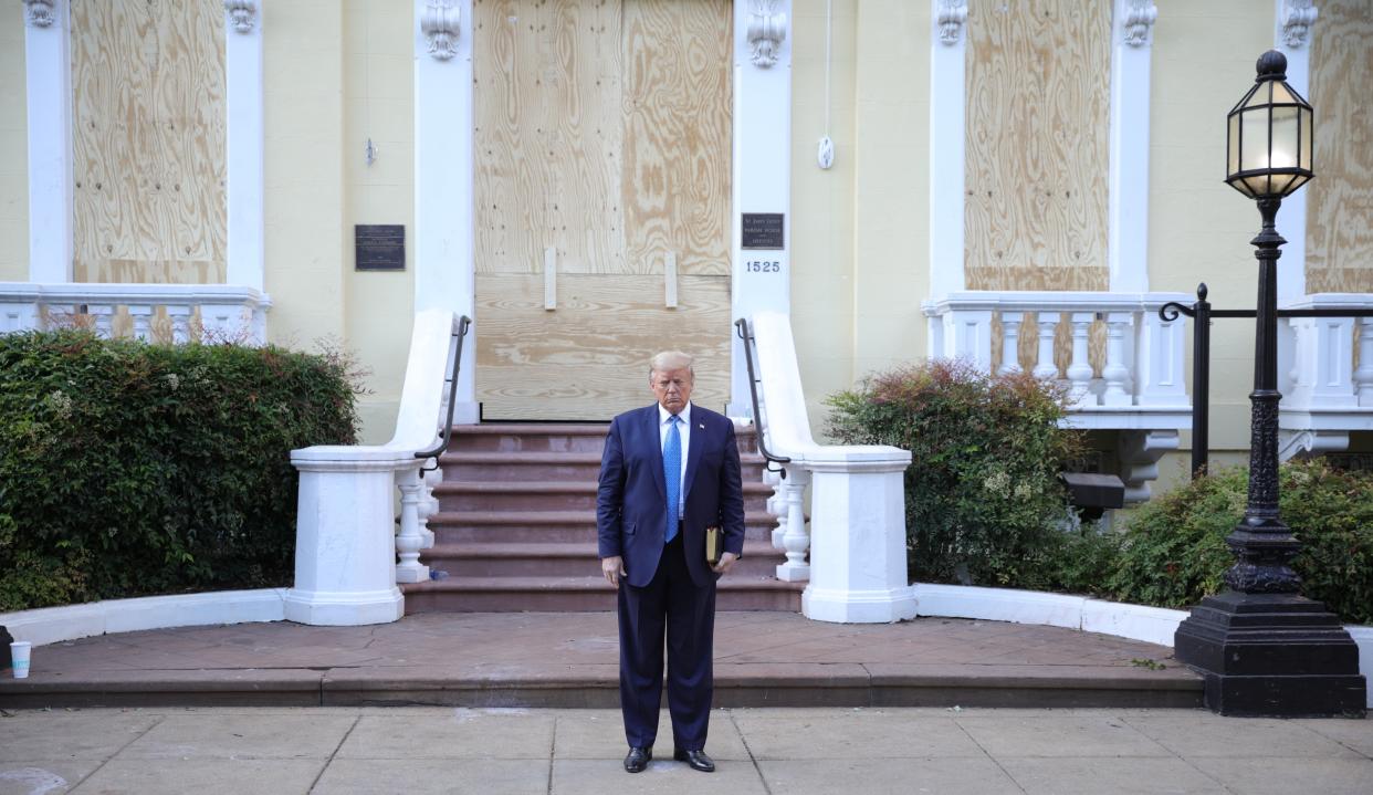 Donald Trump poses outside a church in Lafayette Square after it was cleared of protesters (REUTERS)