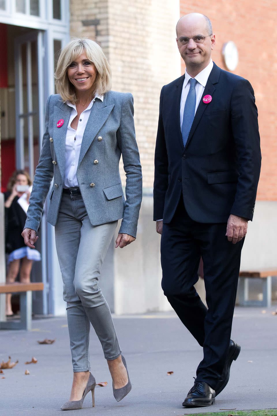 <p>Out in Paris in a gray Alexandre Vauthier blazer, white shirt, skinny pants, and suede pumps. </p>