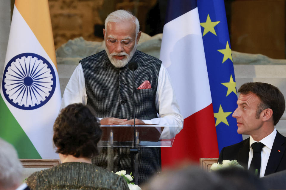 French President Emmanuel Macron, right, listens to Indian Prime Minister Narendra Modi during a dinner at the Louvre museum in Paris, Friday, July 14, 2023. France is looking to further strengthen cooperation on an array of topics ranging from climate to military sales and the strategic Indo-Pacific region. (Pascal Rossignol, Pool via AP)