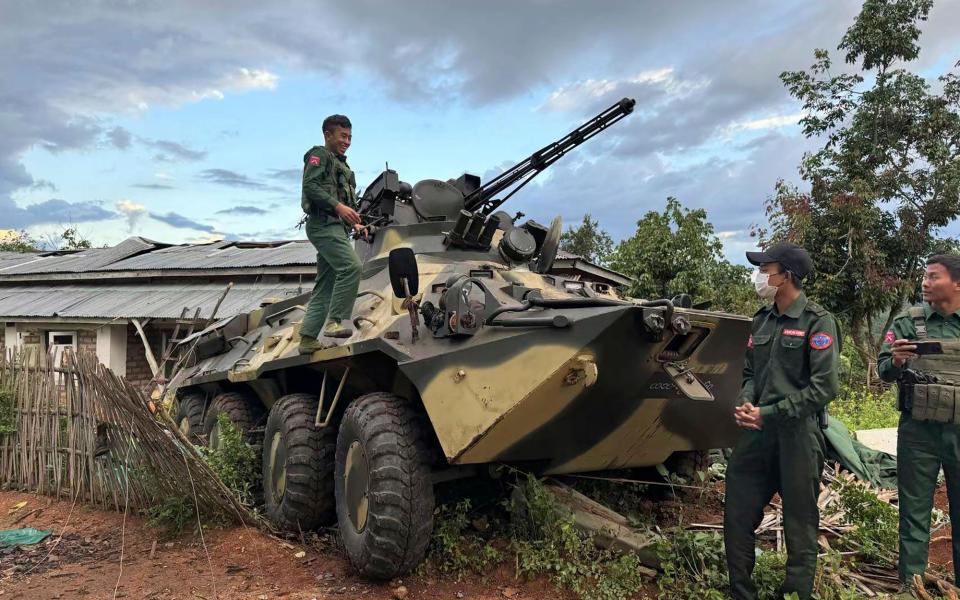 Rebels pose with captured weaponry during the Operation 1027 offensive in November