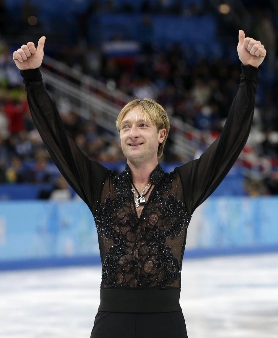 Evgeni Plushenko of Russia gestures to spectators as he leaves the ice after competing in the men's team free skate figure skating competition at the Iceberg Skating Palace during the 2014 Winter Olympics, Sunday, Feb. 9, 2014, in Sochi, Russia. (AP Photo/Darron Cummings, Pool)