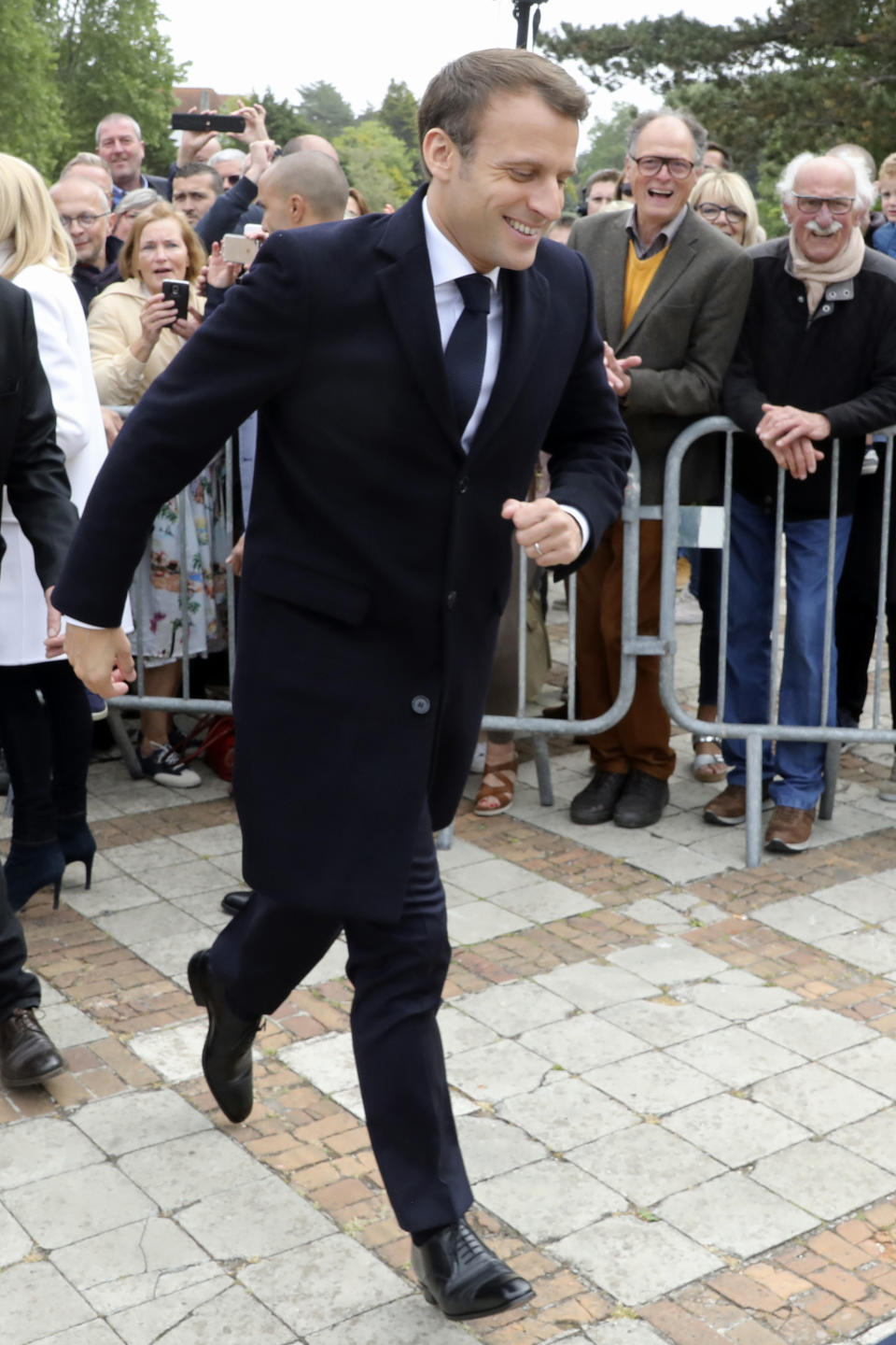 French President Emmanuel Macron leaves after voting in the European elections in Le Touquet, northern France, Sunday May 26, 2019. France is looking at an epic battle between pro-EU centrist President Emmanuel Macron and anti-immigration, far-right flagbearer Marine Le Pen in the European Parliament vote, a duel over Europe's basic values. (Ludovic Marin/Pool via AP)