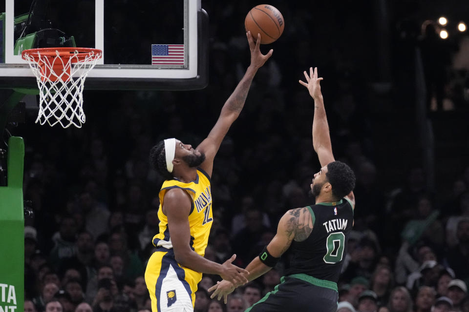 Indiana Pacers forward Isaiah Jackson, left, blocks a shot by Boston Celtics forward Jayson Tatum (0) during the first half of an NBA basketball game Wednesday, Nov. 1, 2023, in Boston. (AP Photo/Charles Krupa)