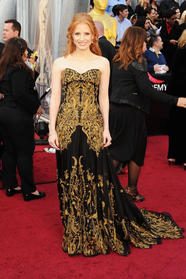 Jessica Chastain <br>Grade: A- <br><br>“The Help’s” best supporting actress nominee looked absolutely lovely in her romantic black-and-gold Alexander McQueen gown, which she accessorized with loose red tresses and $2 million worth of yellow Harry Winston diamonds.