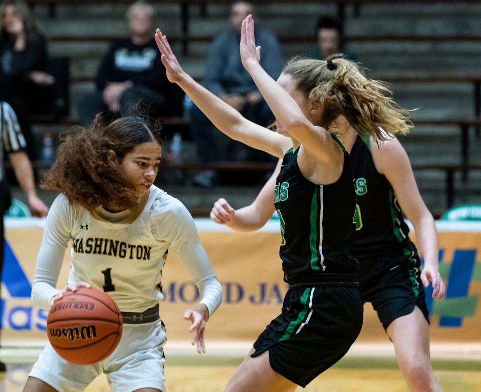 South Bend Washington Panthers guard Amiyah Reynolds (1) pushes past Westfield Shamrock players on Wednesday, Dec. 29, 2021, at the The New Castle Fieldhouse in New Castle. South Bend Washington Panthers defeated the Westfield Shamrocks, 52-50, for the Hall of Fame Classic Tournament Championships.