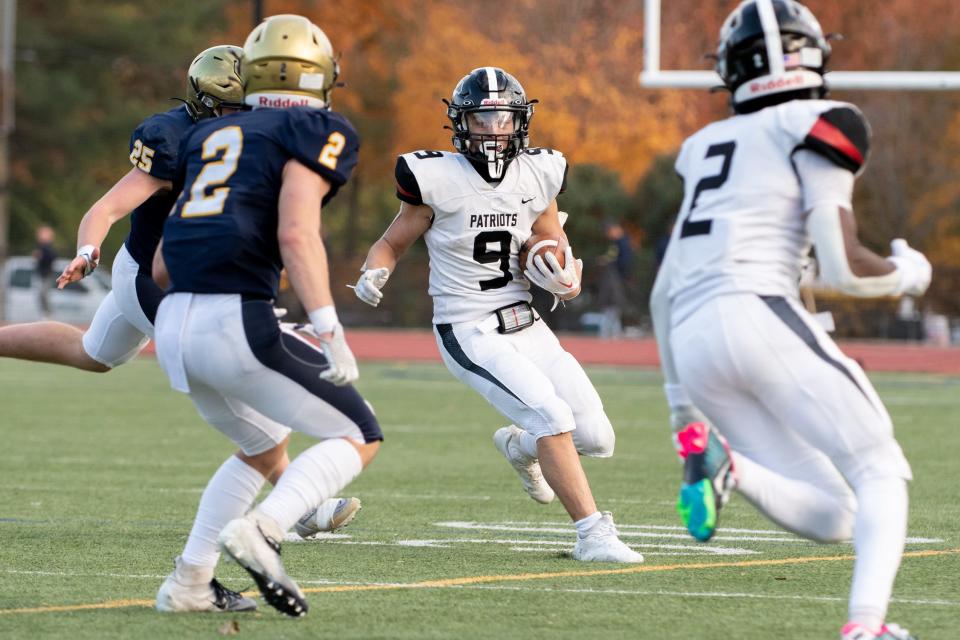 Germantown Academy's Anthony Lara picks up yardage during Saturday's game against Penn Charter.