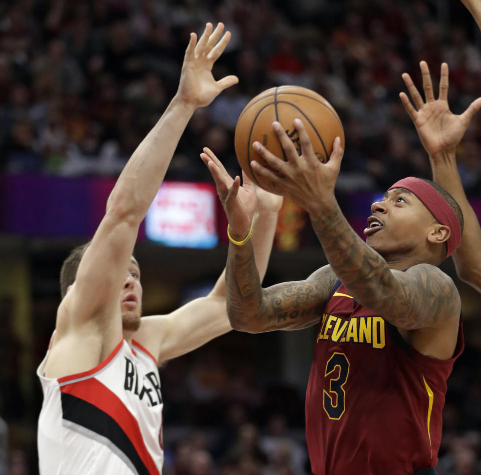 Isaiah Thomas drives to the basket during the second half of Tuesday night’s game against the Trail Blazers and Pat Connaughton. (AP)