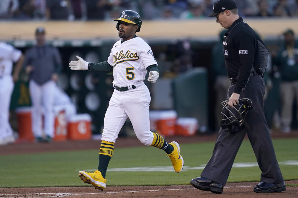 Oakland Athletics' Tony Kemp (5) reacts after hitting a home run against the Houston Astros during the third inning of a baseball game in Oakland, Calif., Monday, July 25, 2022. (AP Photo/Jeff Chiu)