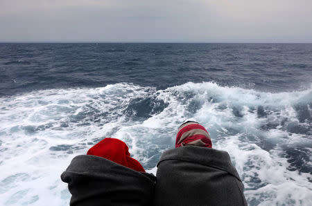 Migrants are seen aboard the former fishing trawler Golfo Azzurro, following their rescue about thirty-two hours ago from their drifting dinghies by Spanish NGO Proactiva Open Arms, in the Mediterranean Sea, off the Libyan coast April 2, 2017.REUTERS/Yannis Behrakis