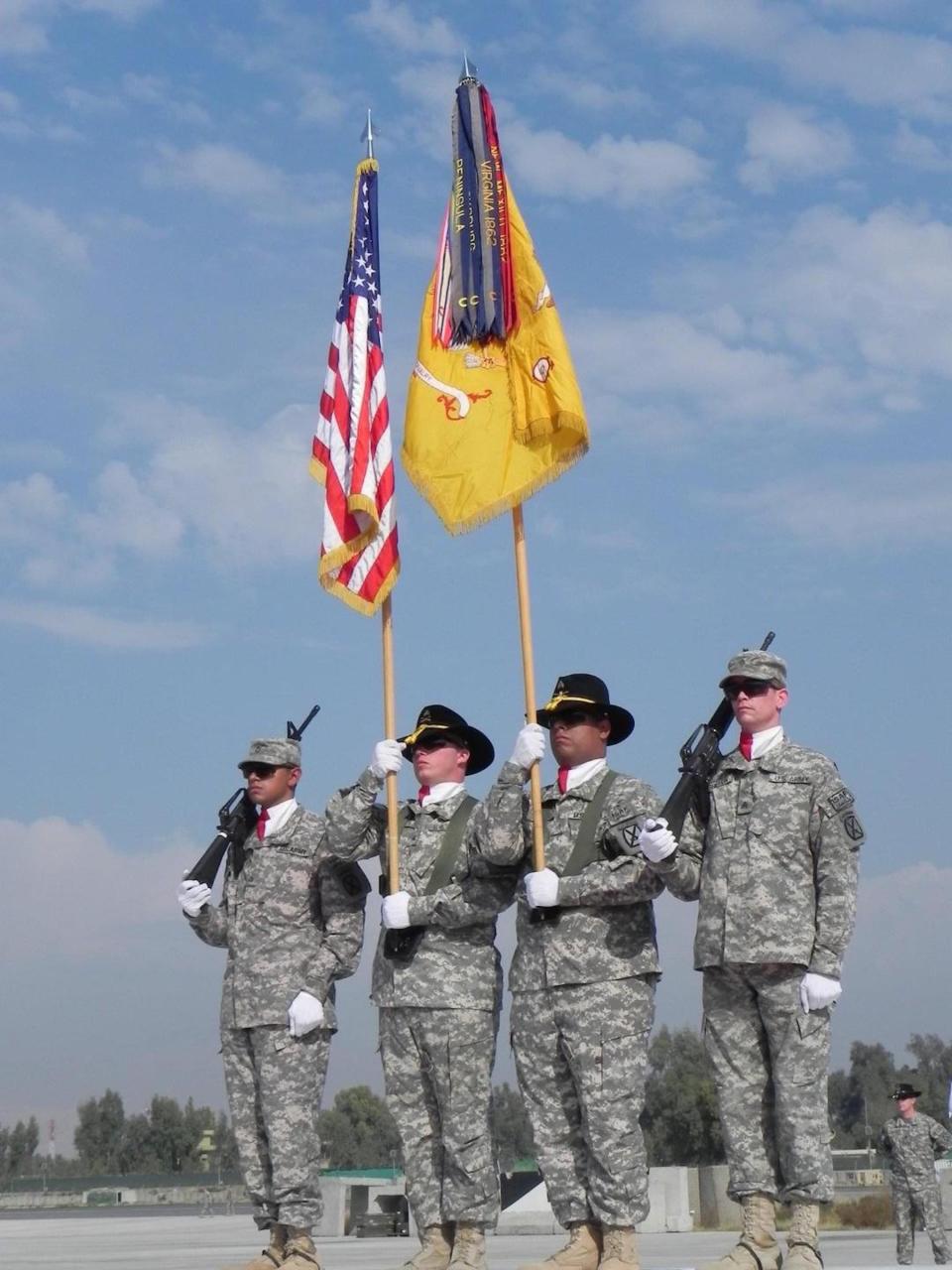 Ortiz carries the colors of 6/6 Cavalry as the unit takes over responsibility for air operations at Forward Operating Base Fenty in Jalalabad, Afghanistan, in October 2010.