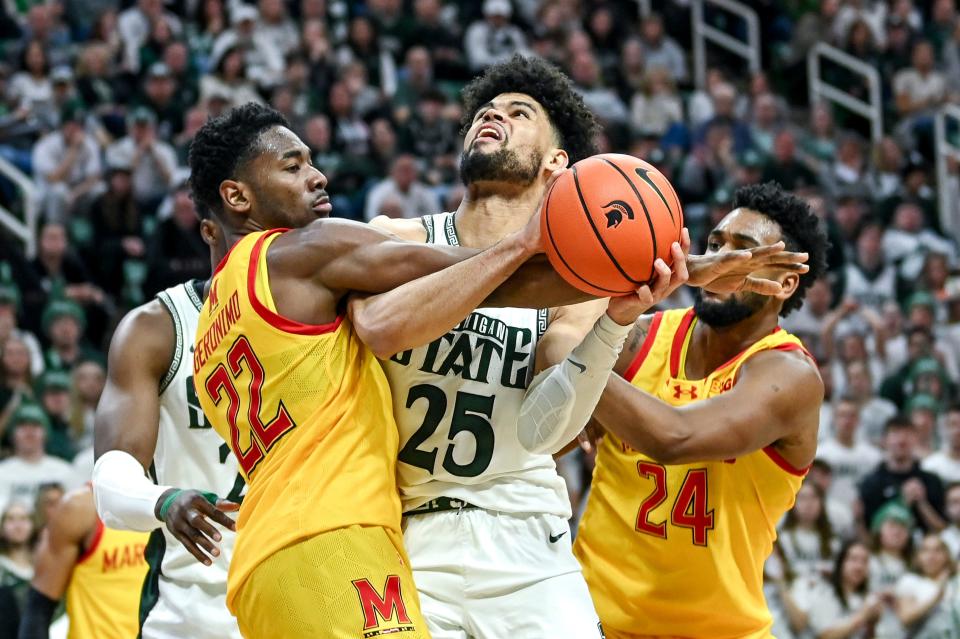 Michigan State's Malik Hall, center, is fouled by Maryland's Jordan Geronimo, left, during the second half on Saturday, Feb. 3, 2024, at the Breslin Center in East Lansing.