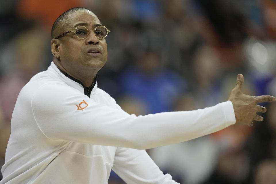 Texas interim head coach Rodney Terry motions to his players during the first half of an NCAA college basketball game against Oklahoma State in the second round of the Big 12 Conference tournament Thursday, March 9, 2023, in Kansas City, Mo. (AP Photo/Charlie Riedel)