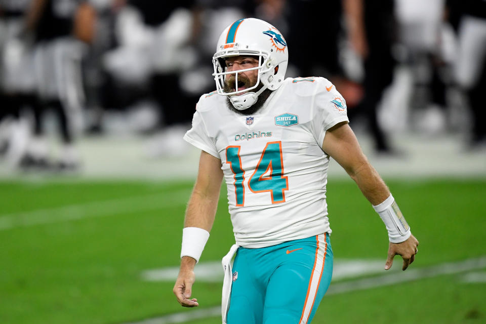 LAS VEGAS, NEVADA - DECEMBER 26:  Ryan Fitzpatrick #14 of the Miami Dolphins reacts to a touchdown pass during the fourth quarter of a game against the Las Vegas Raiders at Allegiant Stadium on December 26, 2020 in Las Vegas, Nevada. (Photo by Harry How/Getty Images)