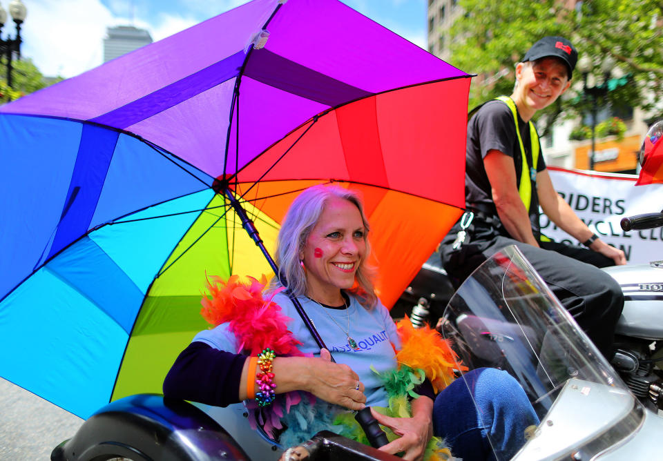 Robyn Ochs, left, gets a ride in a motorcycle sidecar from Peg Preble at the annual Boston Pride Parade on June 8, 2013.<span class="copyright">John Tlumacki—The Boston Globe/Getty Images</span>