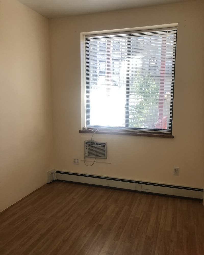 Empty bedroom with beige walls before decorating