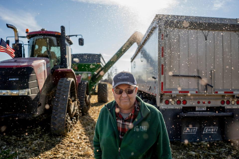 Lonnie Kester stands by as corn harvested to be used for ethanol is loaded into a tractor-trailer on Thursday, Nov. 16, 2023, from a portion of his farmland in Millington, where solar panels will be placed. Kester owns thousands of acres of farmland in the Thumb area, and signed a lease to put solar panels on a portion. But that project was delayed years because due to the township board.