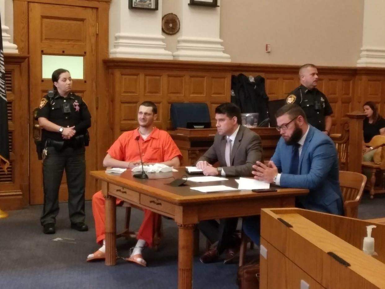 Tyler T. Tomic, in orange jumpsuit, will spend more than five years in prison for the death of Michael S. Icenhower in a 2022 traffic crash. A jury convicted Tomic, 30, of aggravated vehicular homicide charges on Friday. He is shown with defense attorneys Daniel Eisenbre, center, and Ty Graham.
