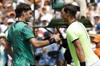 Apr 2, 2017; Key Biscayne, FL, USA; Roger Federer of Switzerland (L) shakes hands with Rafael Nadal of Spain (R) after their match in the men's singles championship of the 2017 Miami Open at Crandon Park Tennis Center. Mandatory Credit: Geoff Burke-USA TODAY Sports