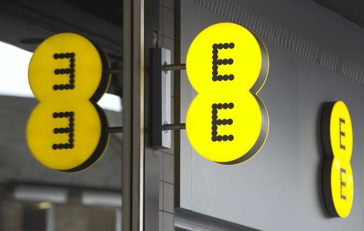 An Everything Everywhere (EE) mobile phone store sign is seen in London February 20, 2013. REUTERS/Neil Hall