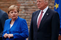 <p>German Chancellor Angela Merkel and President Donald Trump pose for a family photo with G7 leaders at the Ancient Greek Theater of Taormina, Friday, May 26, 2017, in Taormina, Italy. (Photo: Evan Vucci/AP) </p>