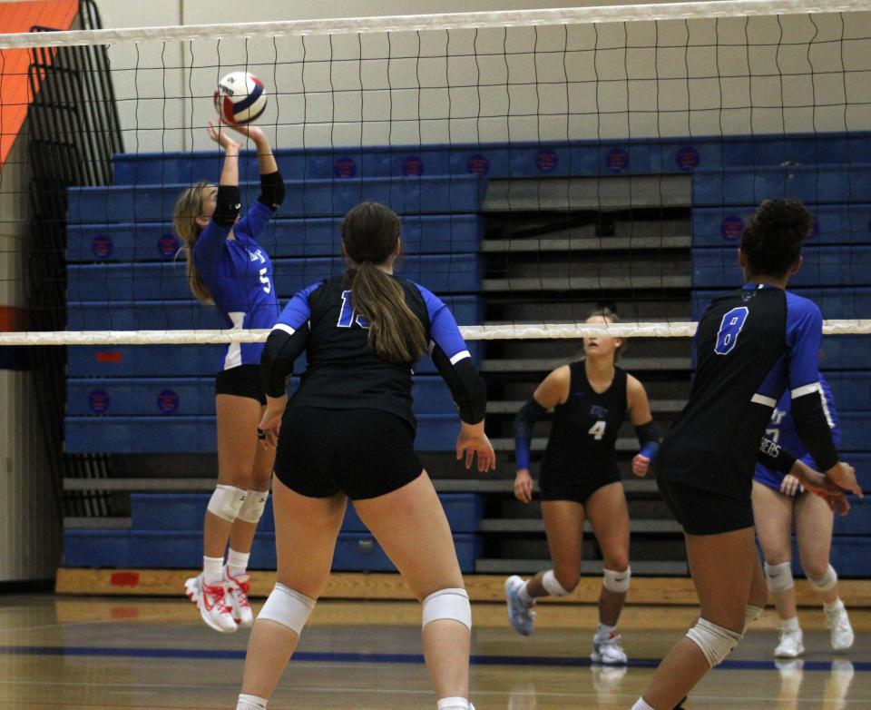 Bartram Trail's Sydney Lewis (5) sets the ball for a teammate during a match against Ridgeview, Saturday, Sept. 24, 2022.