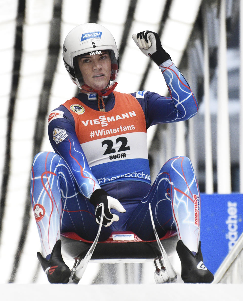 Summer Britcher of the U.S. reacts after finishing in women competition at the Luge World Cup 2018/2019 in Sochi, Russia, Saturday, Feb. 23, 2019. (AP Photo/Ekaterina Lyzlova)