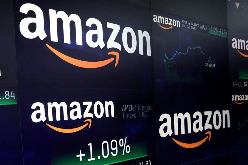 FILE PHOTO: The Amazon.com logo and stock price information is seen on screens at the Nasdaq Market Site in New York City
