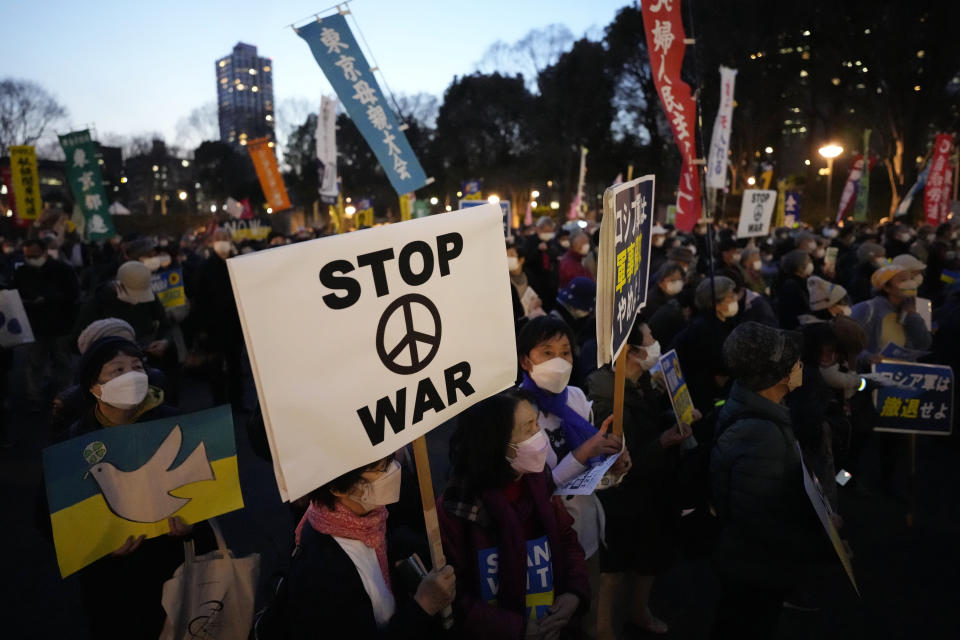 Protesters hold banners during a rally against Russia's invasion of Ukraine, Friday, March 11, 2022, in Tokyo. (AP Photo/Eugene Hoshiko)