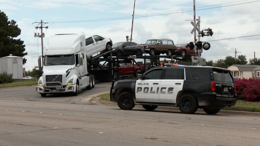 <em>Semi-truck stuck on railroad in Abilene at North 1st-Victoria St intersection</em>