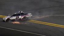 Brad Keselowski (2) slides to the bottom of the track after crashing during the second NASCAR Daytona 500 duel qualifying auto race Friday, Feb. 12, 2021, at the Daytona International Speedway in Daytona Beach, Fla. (AP Photo/Chris O'Meara)