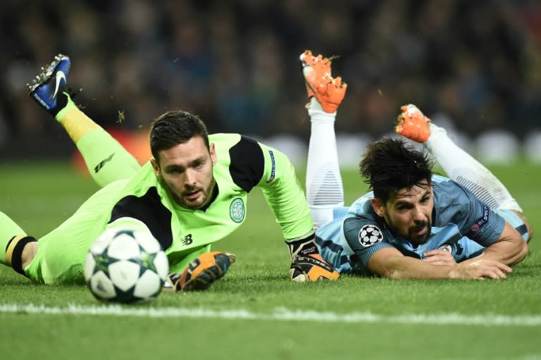 Manchester City's midfielder Nolito (R) vies with Celtic's goalkeeper Craig Gordon during the UEFA Champions League group C football match between Manchester City and Celtic at the Etihad Stadium on December 6, 2016