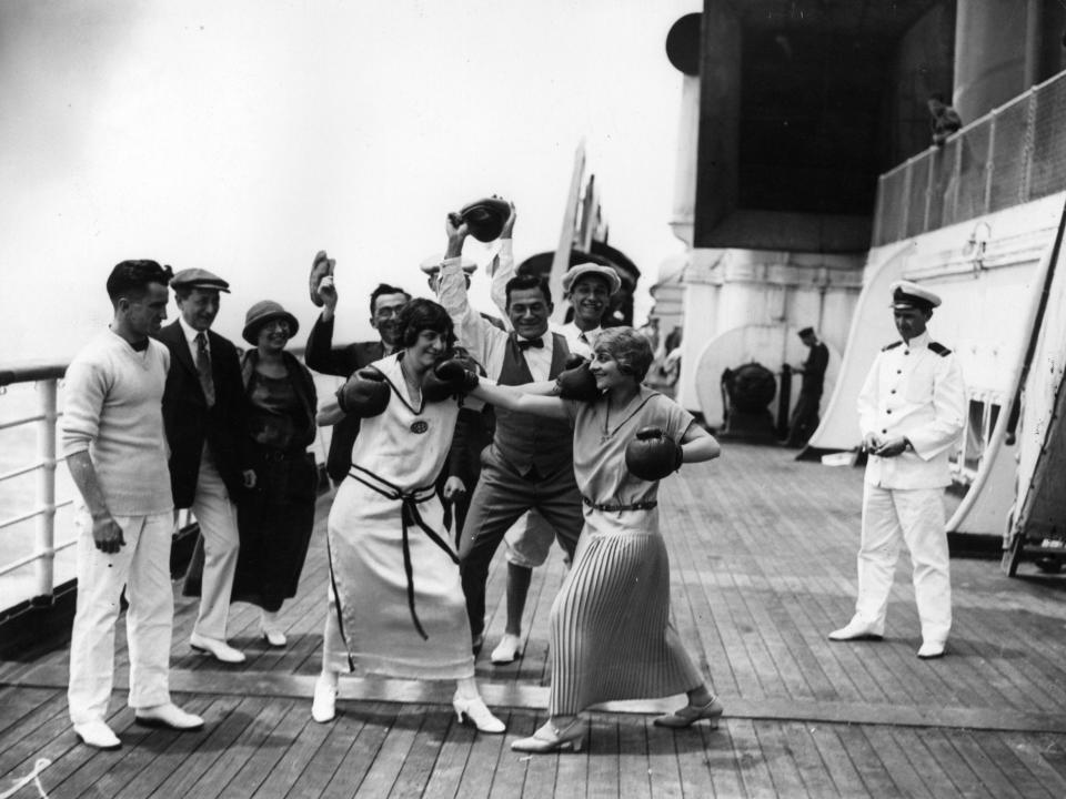 Two women passengers boxing aboard Cunard liner Berengaria.