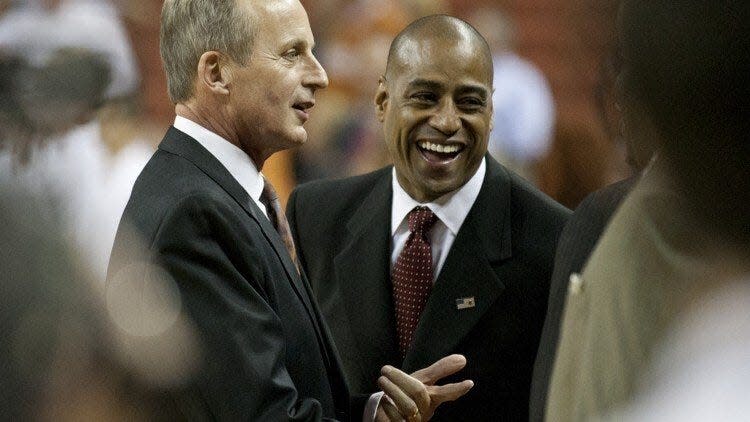 In this 2012 game in Austin, Texas basketball coach Rick Barnes, left, visits with his former assistant coach, Rodney Terry, who was then the head coach of Fresno State. Twelve years later, Barnes is coaching the Tennessee Volunteers, Terry leads the Longhorns and the two coaches and teams may be on a second-round collision course in the NCAA Tournament.