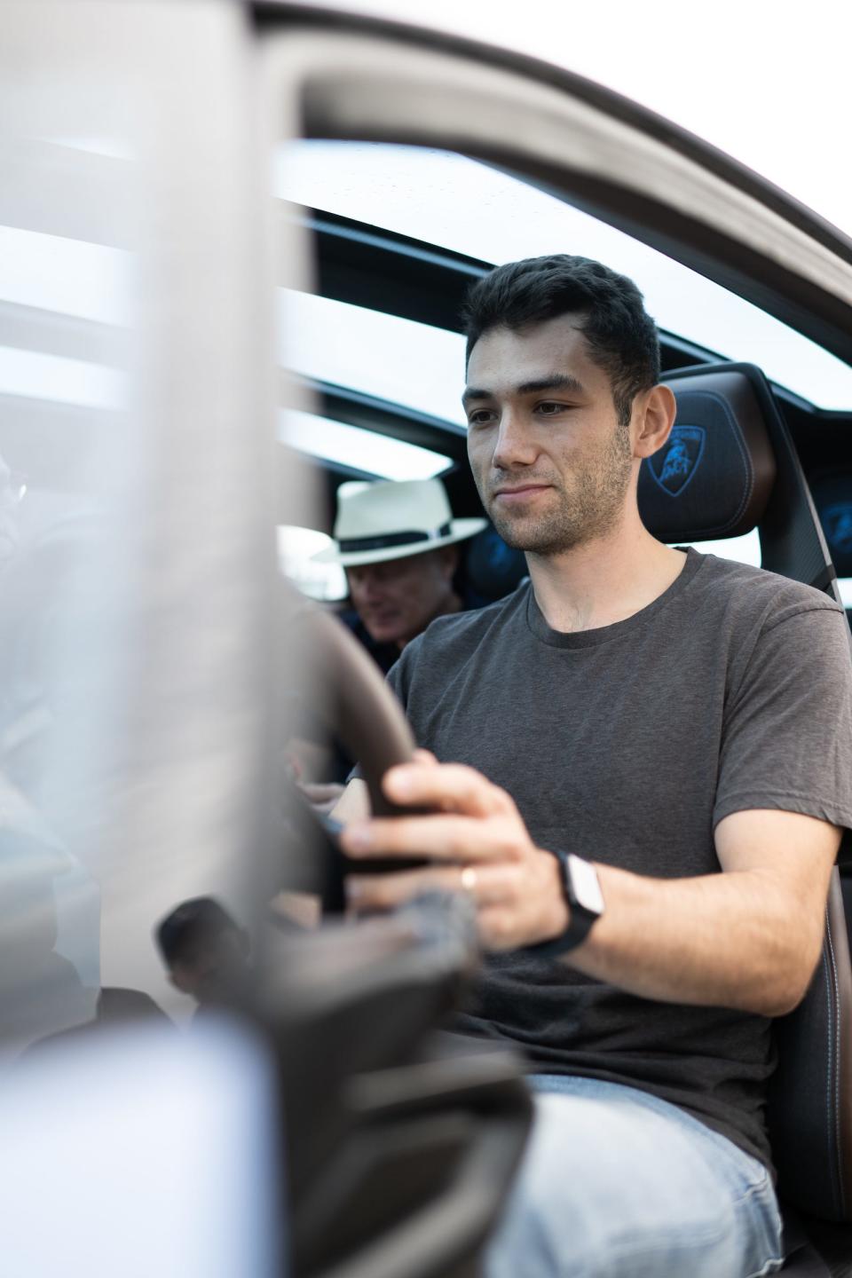 Insider reporter Tim Levin sits inside the Lamborghini Lanzador. 