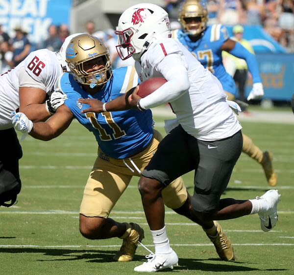 Pasadena, CA - UCLA Bruins linebacker Gabriel Murphy zeroes in on a sack of Washington State.