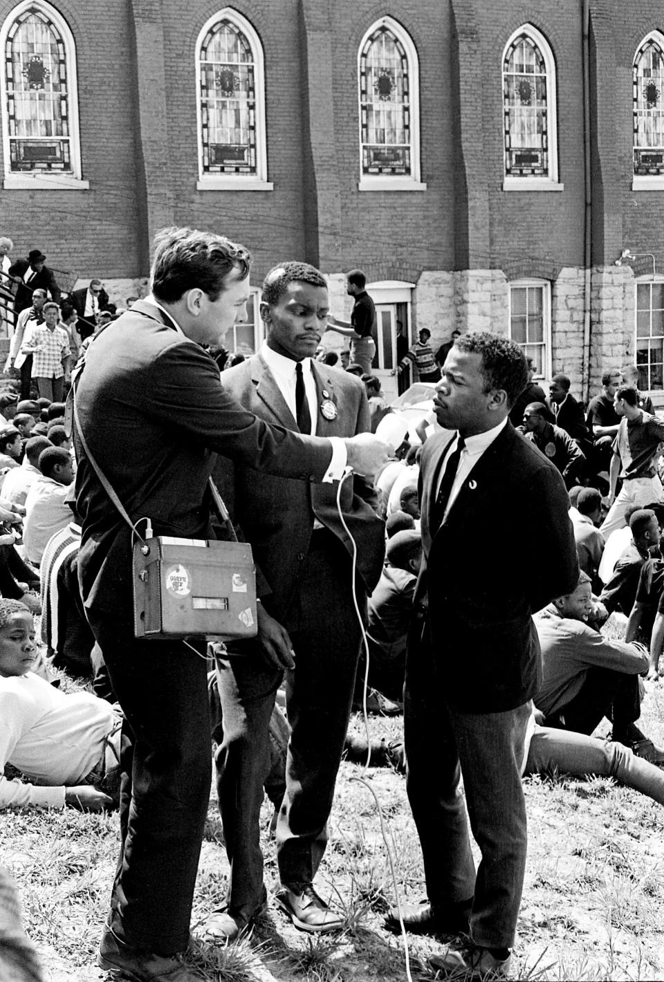 John Lewis, right, and Lester McKinnie, center, are interviewed by ABC News at the sit-in demonstrators' base at the First Baptist Church in Nashville on April 30, 1964. | J.T. Phillips—The Tennessean/Imagn Content Services/USA Today Network/Reuters